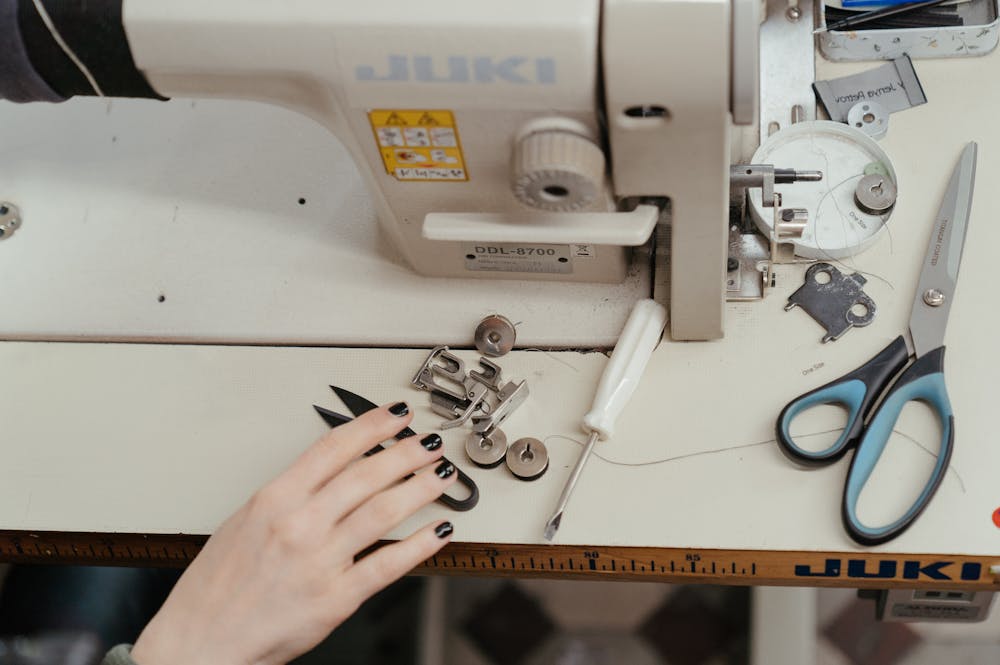 Tools and materials for altering pants at home.