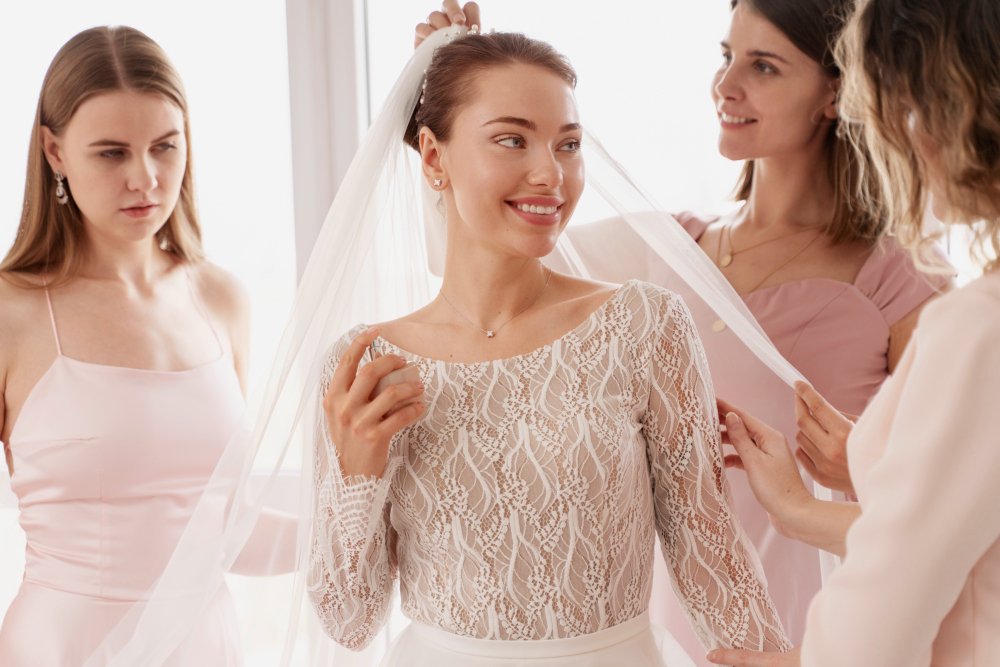 Bride checking the fit of her dress at a wedding dress fitting