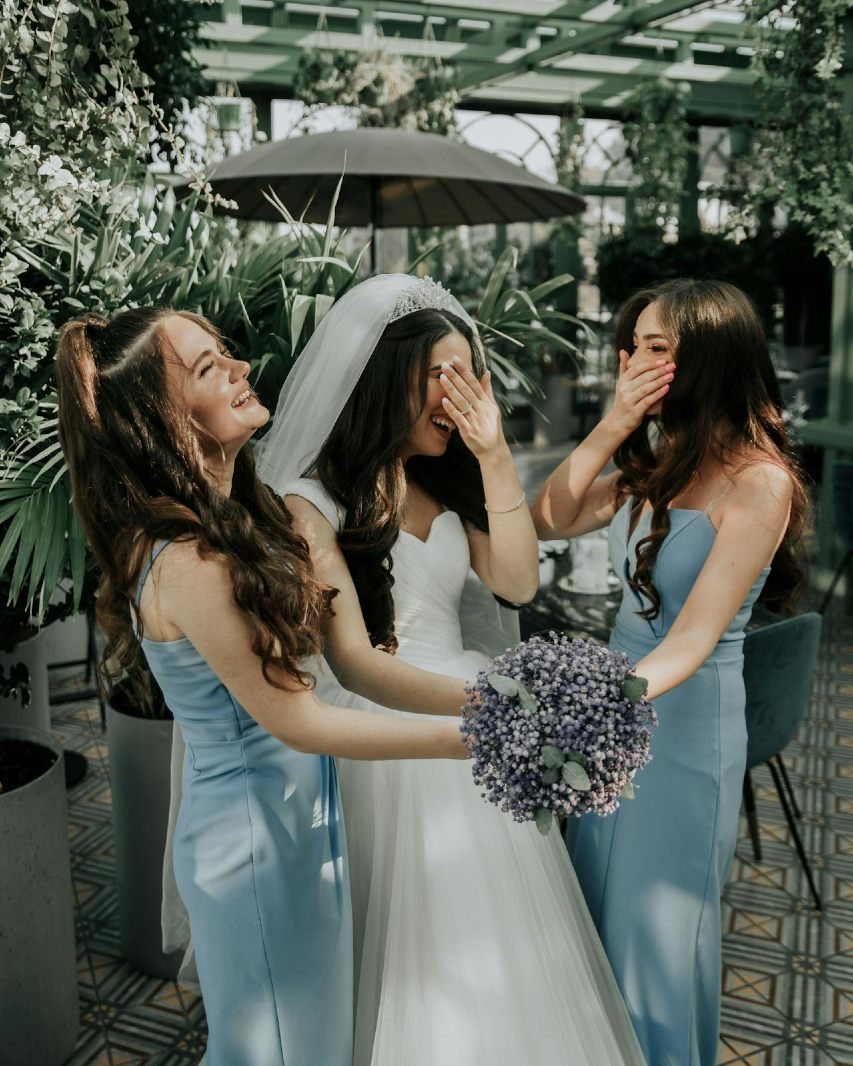 Expert tailor making adjustments to a bridesmaid dress