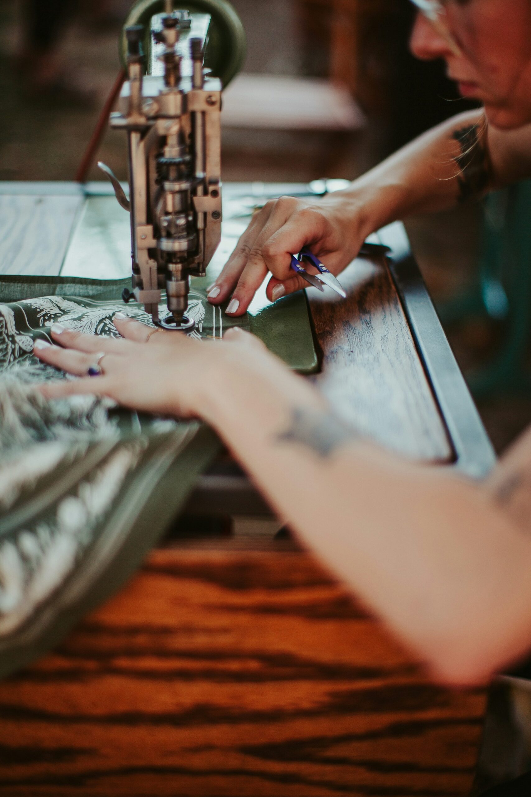 A pair of pants being hemmed quickly for same day service.