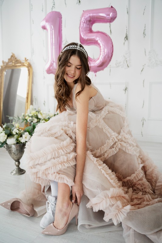 quinceanera-dress-alterations-near-you a woman in a quinceanera dress