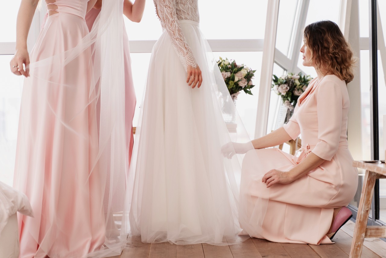 Women making wedding dress preservation