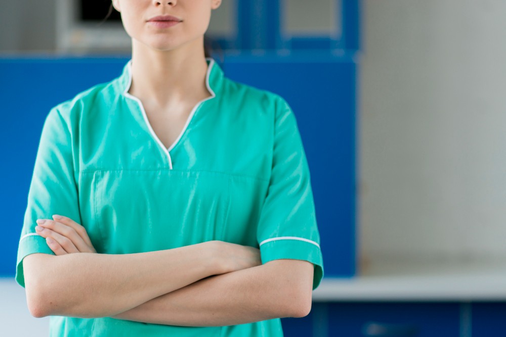 Woman working in scrubs uniform