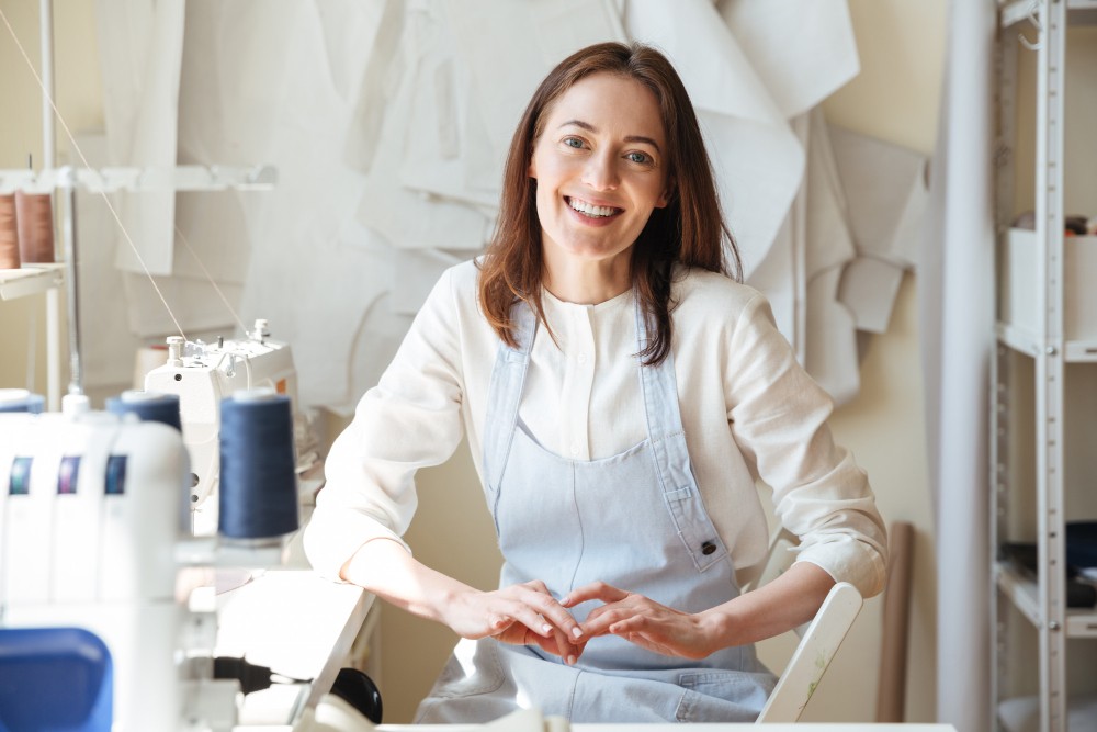 Professional tailor making big clothes smaller