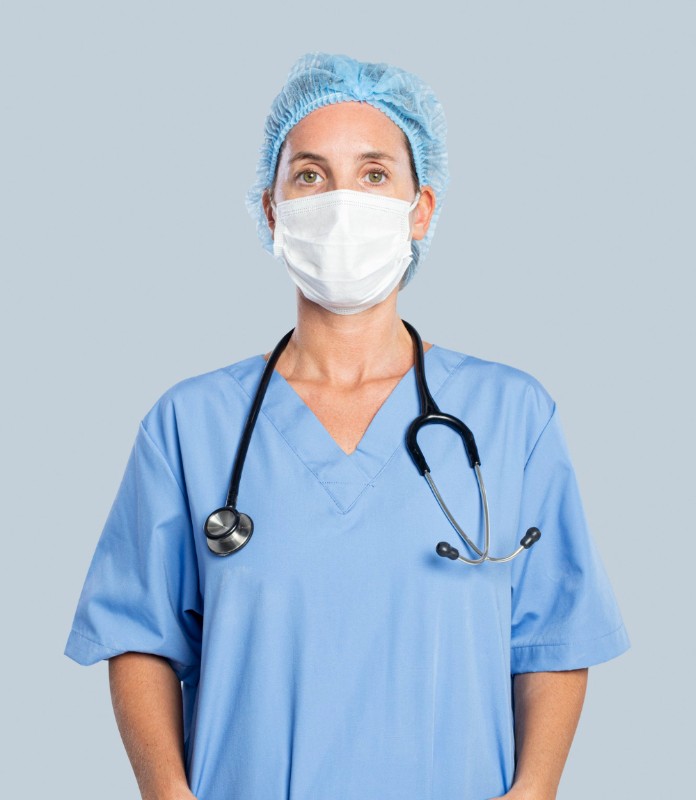 Woman in medical uniform working