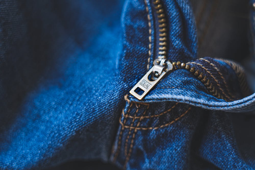 Close-up of a zipper slider repair