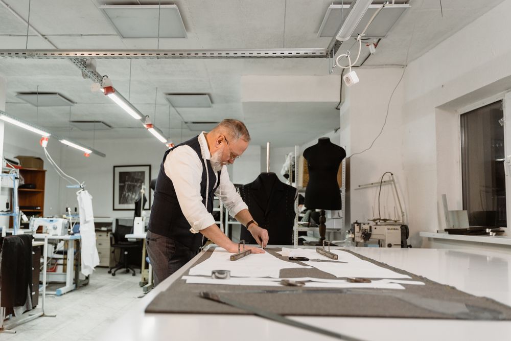 Professional tailor performing mens suit alterations